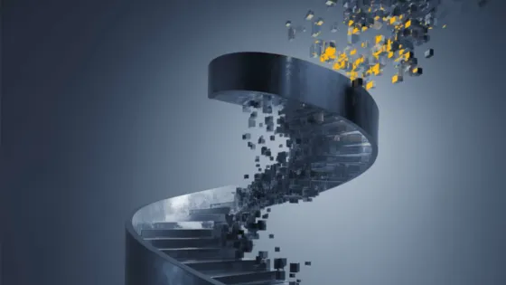 A spiral staircase appears to break apart into pixels floating away from it